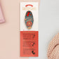 Gold Enamel Talisman Pin with red and blue design and the words RPG Talisman sits on a long white and red backing card with gold accents. The backing card has details the symbolism of the different design elements of the Talisman pin.