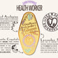 A detailed illustration outlining the symbolism of the Health Worker's Talisman gold enamel pin on a gold foiled backing card that outlines the symbolism of the talisman