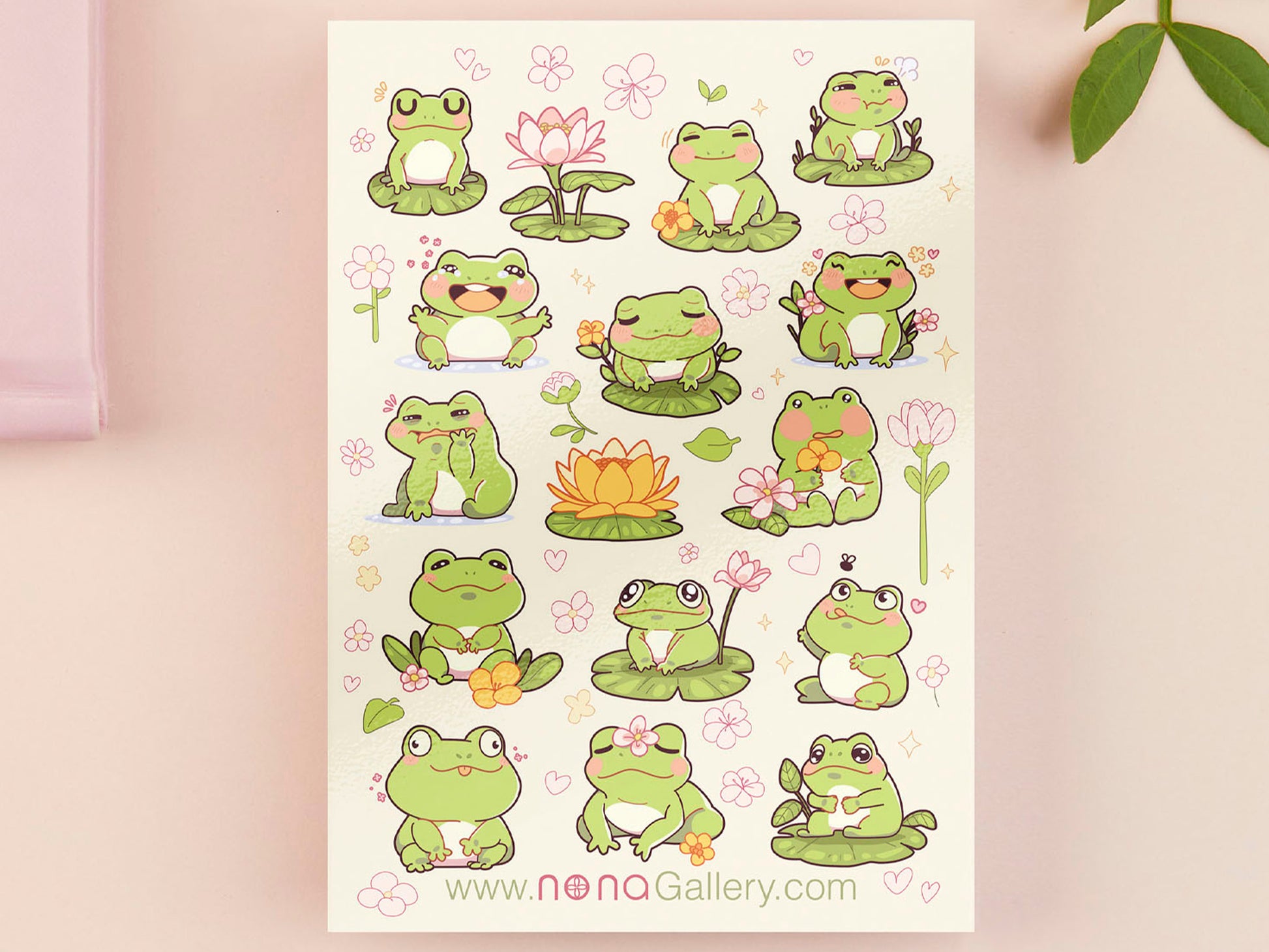 A large pastel coloured gloss vinyl sticker sheet with multiple cute frogs and lily pad stickers