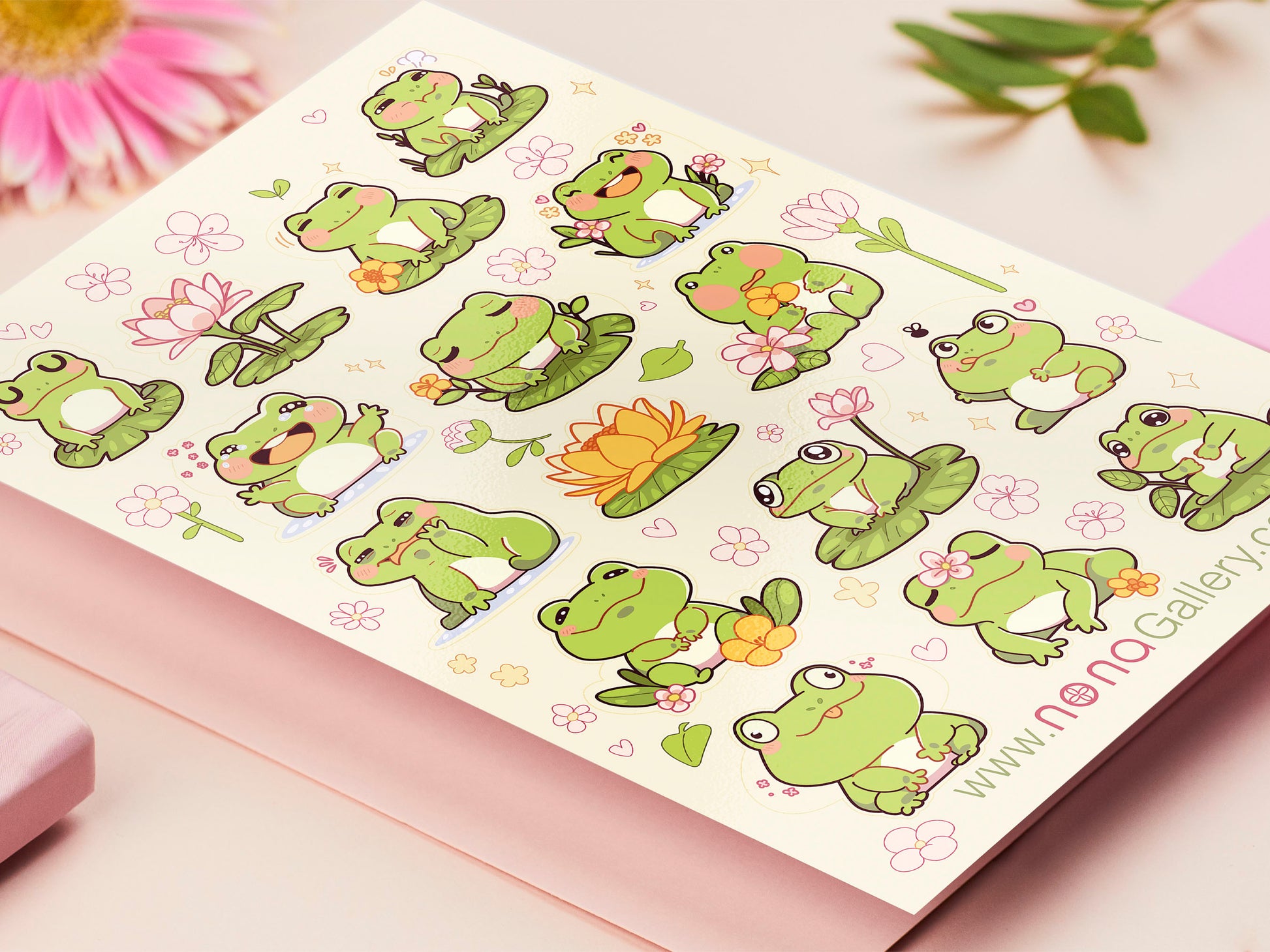 A large pastel coloured gloss vinyl sticker sheet with multiple cute frogs and lily pad stickers
