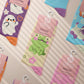 Multiple Cute knitted cotton crew socks with autumn-themed ghost designs, cute cats and kittens, and funny pastel frogs.