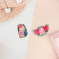 Two peelable stickers, the first sticker is a gaming headset with the words So OP! The second sticker is an F keyboard button with roses with a ribbon and text that reads Press F to pay respects