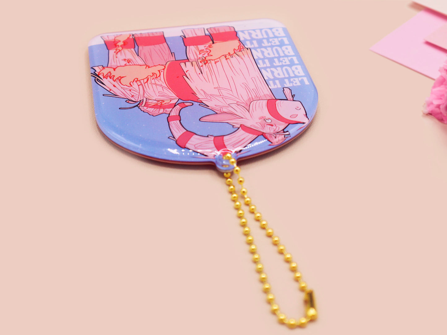 Acrylic epoxy christmas tree hanging decoration with a large acrylic charm of a cute crying gavle straw goat in the snow on fire with the quote let it burn let it burn let it burn