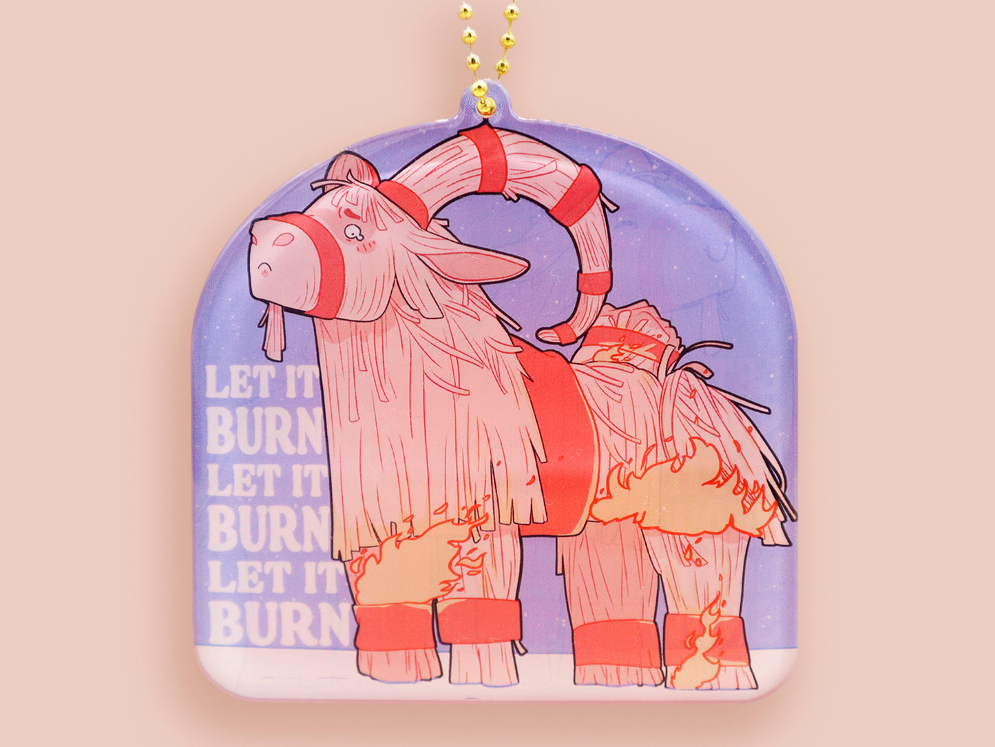 Acrylic epoxy christmas tree hanging decoration with a large acrylic charm of a cute crying gavle straw goat in the snow on fire with the quote let it burn let it burn let it burn