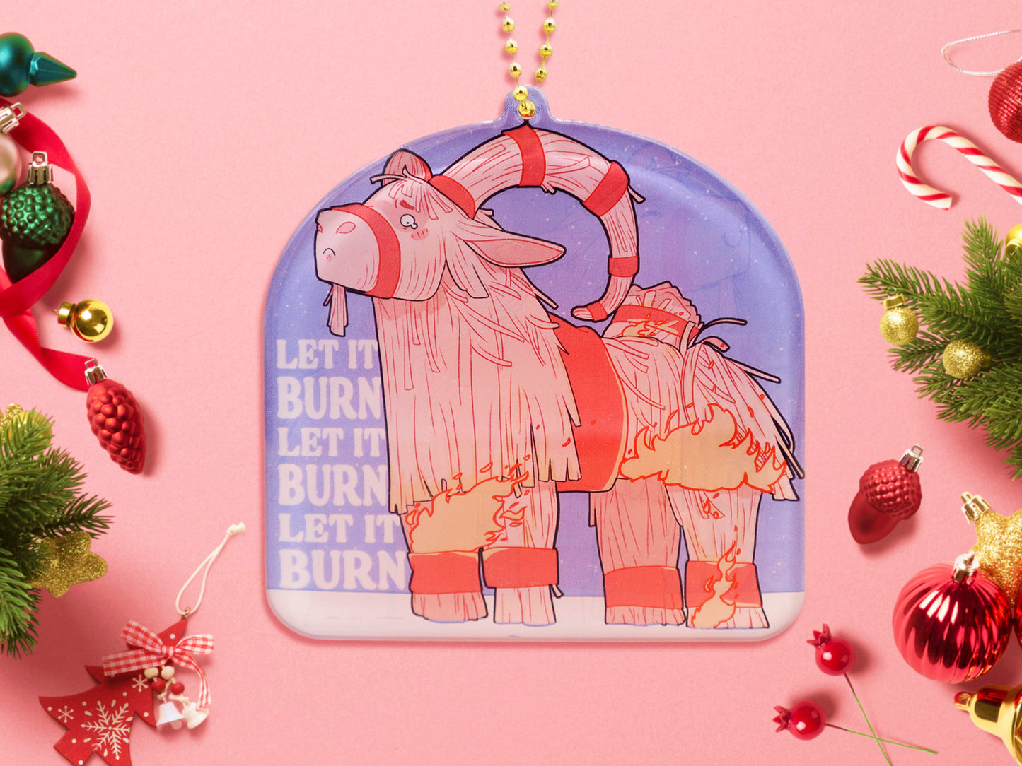 Acrylic epoxy christmas tree hanging decoration with a large acrylic charm of a cute crying gavle straw goat in the snow on fire with the quote let it burn let it burn let it burn