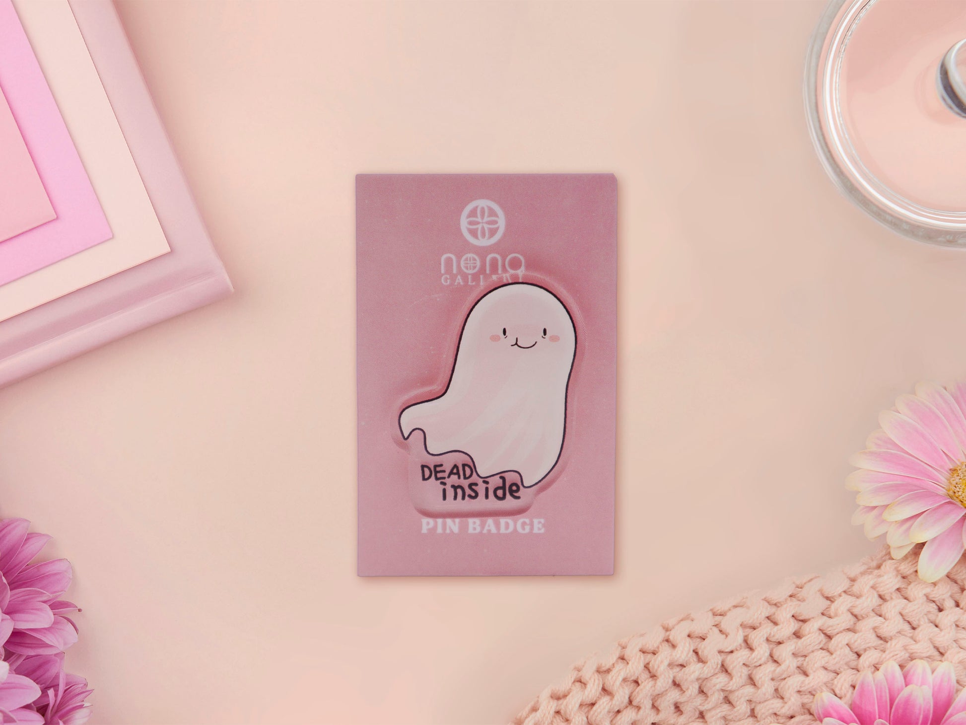 Acrylic pin badge on backing card of smiling but depressed cartoon ghost with the quote dead inside written below.