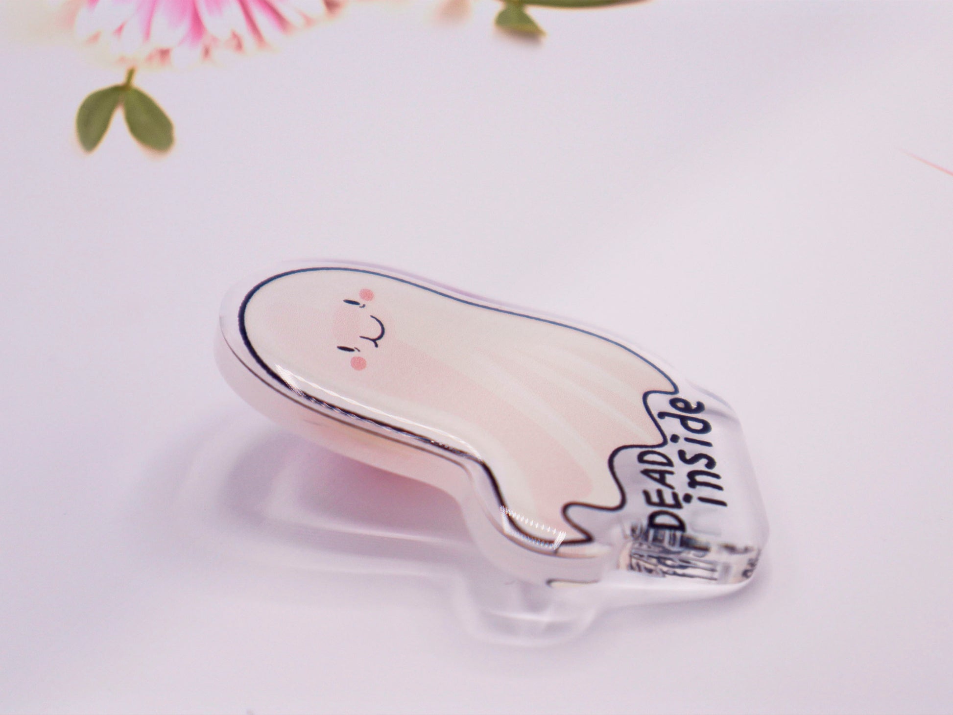 Acrylic pin badge of smiling but depressed cartoon ghost with the quote dead inside written below.