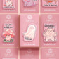 Multiple funny acrylic pin badges on pink backing cards, all with different cute cartoon designs.