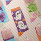 Multiple Cute knitted cotton crew socks with autumn-themed ghost designs, cute cats and kittens, and funny pastel frogs.
