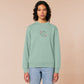 An embroidered green sweater design of a cute alien cat floating in space surrounded by stars and planets and by the quote beam me up! I want to leave