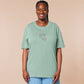 An embroidered green t-shirt design of a cute alien cat floating in space surrounded by stars and planets and by the quote beam me up! I want to leave