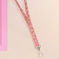 Cute full legth pink lanyard with a double sided guinea pig pattern and silver swivel hook clasp.