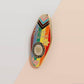 Gold Enamel Talisman Pin with progress pride flag design and the words Pride Talisman, Freedom Equality Visibility. The pins design includes a heart, flowers and crystals.
