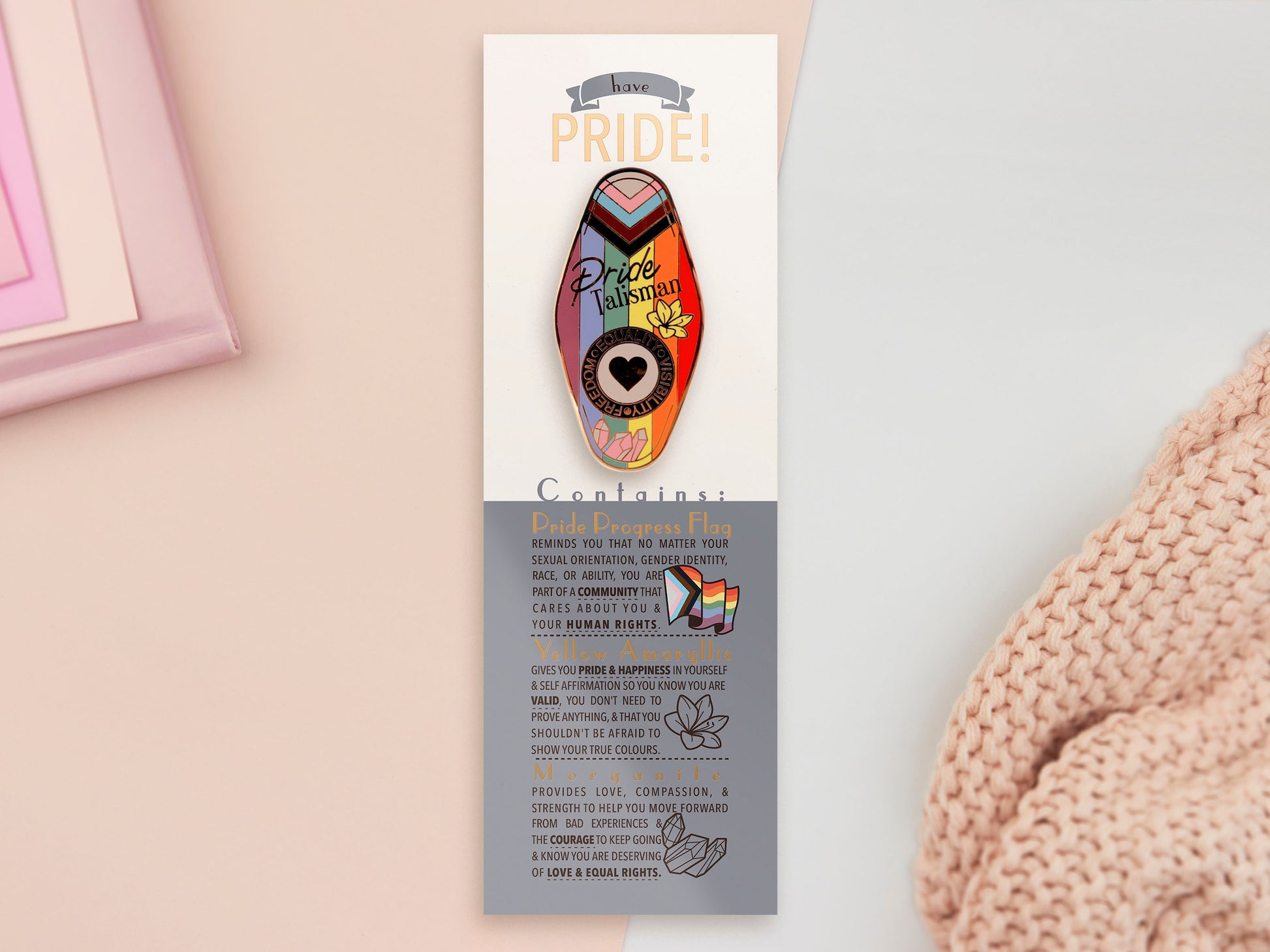 Gold Enamel Talisman Pin with progress pride flag design and the words Pride Talisman, Freedom Equality Visibility. The pins design includes a heart, flowers and crystals.