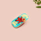 A clear acrylic pin badge with a pink heart-shaped pin back clasp. The design of the pin badge is of a cute chibi retro astronaut floating in sapce with the quote Houston I have so many problems