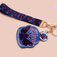 Acrylic epoxy Mothman Cryptid keychain with a large acrylic charm of a cute Mothman with the quote I believe in Mothman and Mothman belives in me, a smaller charm of a cute chibi Mothman and a matching Mothman lanyard.