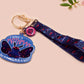 Acrylic epoxy Mothman Cryptid keychain with a large acrylic charm of a cute Mothman with the quote I believe in Mothman and Mothman belives in me, a smaller charm of a cute chibi Mothman and a matching Mothman lanyard.