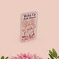 Clear acrylic pin badge with pink heart-shaped rubber pin back clasp. The design of the pin badge is a cute cartoon chibi white rabbit with the quote Woke Up And Chose Violence.