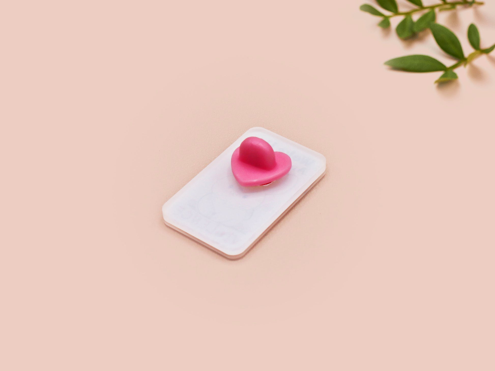 Clear acrylic pin badge with pink heart-shaped rubber pin back clasp. The design of the pin badge is a cute cartoon chibi white rabbit with the quote Woke Up And Chose Violence.