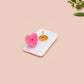 Clear acrylic pin badge with pink heart-shaped rubber pin back clasp. The design of the pin badge is a cute cartoon chibi white rabbit with the quote Woke Up And Chose Violence.