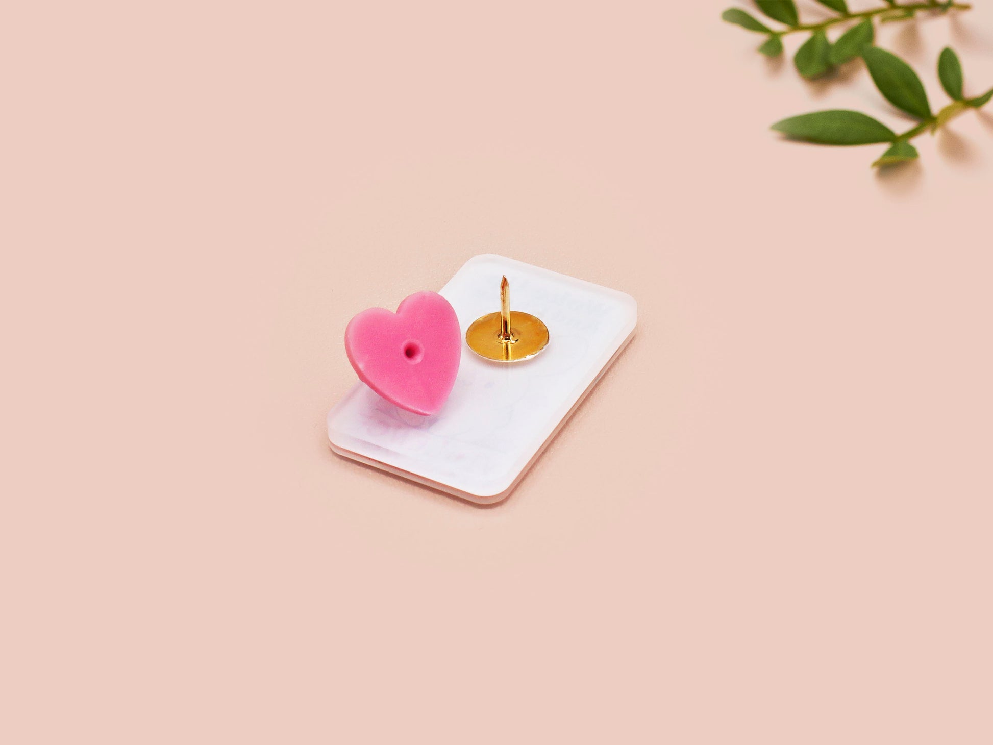 Clear acrylic pin badge with pink heart-shaped rubber pin back clasp. The design of the pin badge is a cute cartoon chibi white rabbit with the quote Woke Up And Chose Violence.