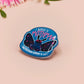 Clear acrylic pin badge with pink heart-shaped rubber pin back clasp. The design of the pin badge is a cute cartoon chibi Mothman cryptid with the quote I believe in Mothman and Mothman believes in me.