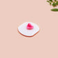 A clear acrylic pin badge with a pink heart-shaped pin back clasp. The design of the pin badge is of a cute chibi potato with the quote I'm a lil' stressed potato