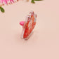 Clear acrylic pin badge with pin heart-shaped pin back clasp. The design of the pin badge is a cute cartoon ginger cat sat in a small cardboard box with the quote if I fits I sits.