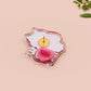 Clear acrylic pin badge with pin heart-shaped pin back clasp. The design of the pin badge is a cute cartoon ginger cat sat in a small cardboard box with the quote if I fits I sits.