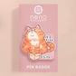 Clear acrylic pin badge with pin heart-shaped pin back clasp. The design of the pin badge is a cute cartoon ginger cat sat in a small cardboard box with the quote if I fits I sits.