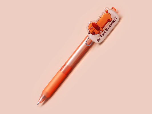 Orange ballpoint pen with black ink and a cute chibi dachshund sausage dog design.