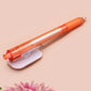 Orange ballpoint pen with black ink and a cute chibi dachshund sausage dog design.