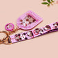 Acrylic epoxy possum keychain with a large acrylic charm of a purple screaming possum with the quote is it me am I the drama, a smaller charm of a cute crying possum and a matching purple possum lanyard.