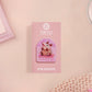 A clear acrylic pin badge with a pink heart-shaped pin back clasp. The design of the pin badge is of a cute screaming possum with the quote is it me am I the drama?