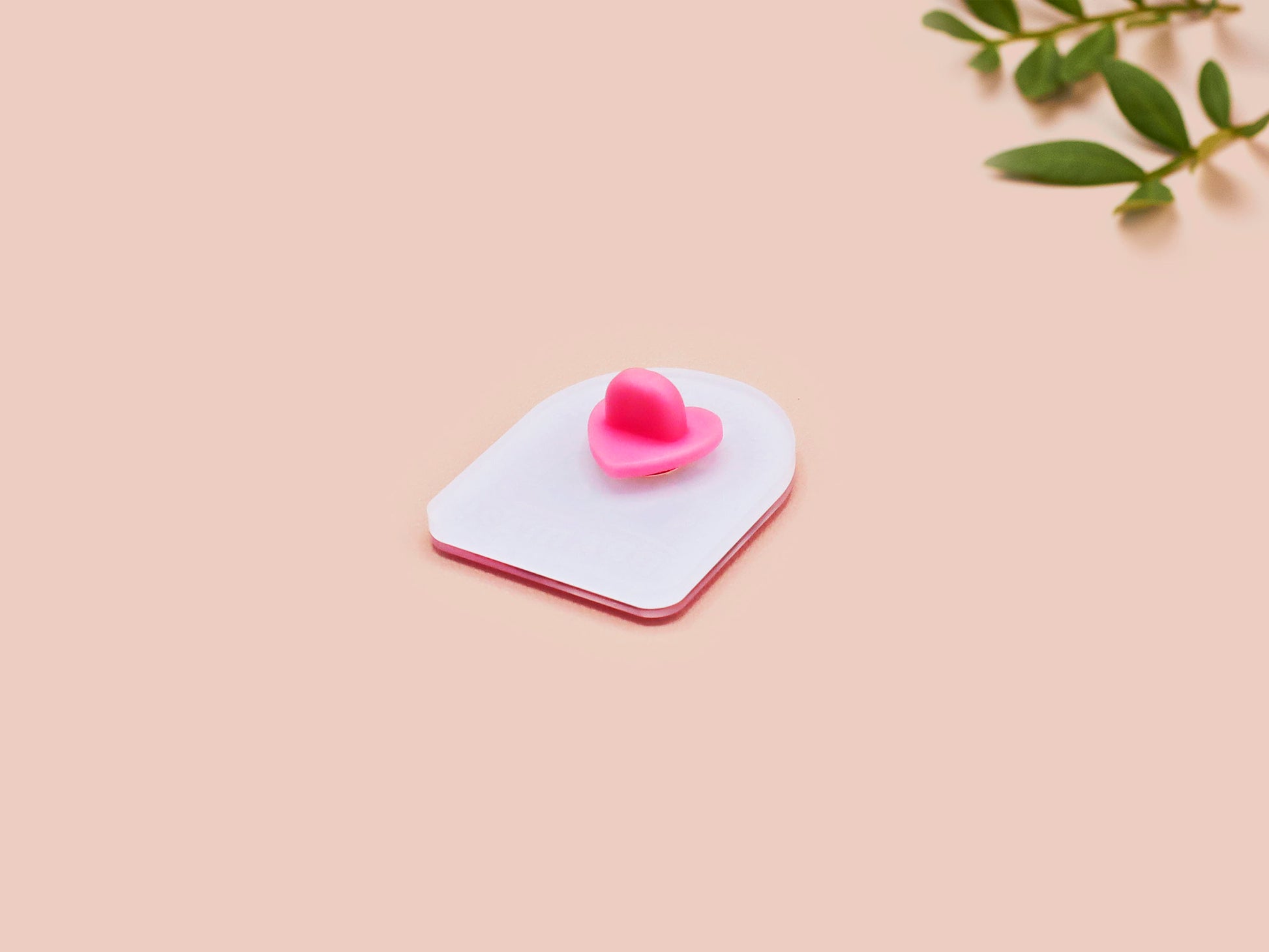 A clear acrylic pin badge with a pink heart-shaped pin back clasp. The design of the pin badge is of a cute screaming possum with the quote is it me am I the drama?