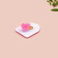 A clear acrylic pin badge with a pink heart-shaped pin back clasp. The design of the pin badge is of a cute screaming possum with the quote is it me am I the drama?
