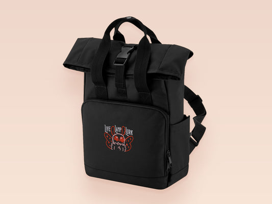 Black roll top backpack with a front pocket and an embroided mothman cryptid design with the lext live lamp lurk