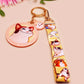 Acrylic epoxy meme cat keychain with a large acrylic charm of popcat , a smaller charm of smudge cat and a matching lanyard with multiple different internet famous meme cats.
