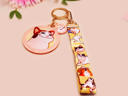Acrylic epoxy meme cat keychain with a large acrylic charm of popcat , a smaller charm of smudge cat and a matching lanyard with multiple different internet famous meme cats.