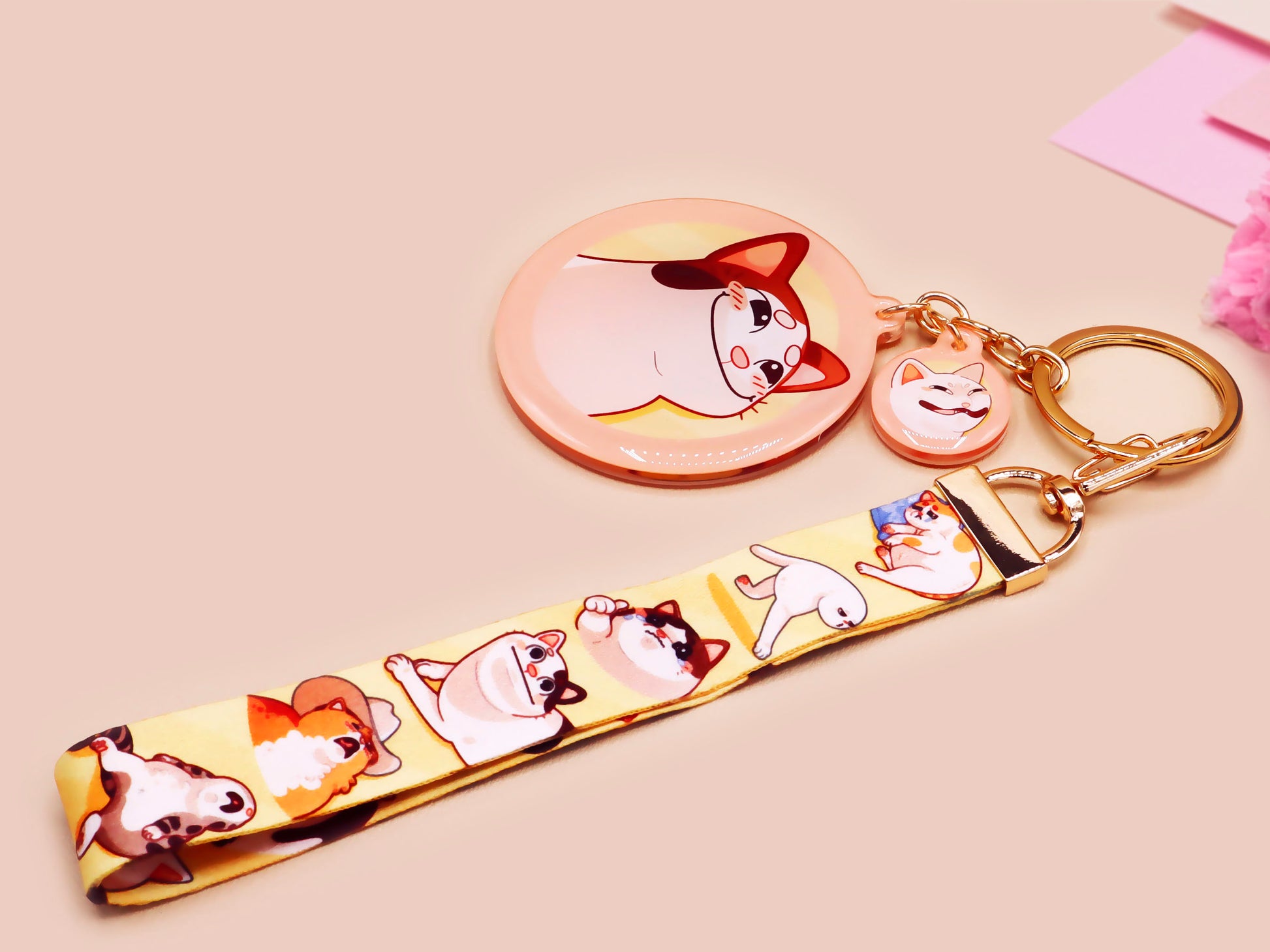 Acrylic epoxy meme cat keychain with a large acrylic charm of popcat , a smaller charm of smudge cat and a matching lanyard with multiple different internet famous meme cats.