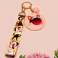 Acrylic epoxy meme cat keychain with a large acrylic charm of popcat , a smaller charm of smudge cat and a matching lanyard with multiple different internet famous meme cats.