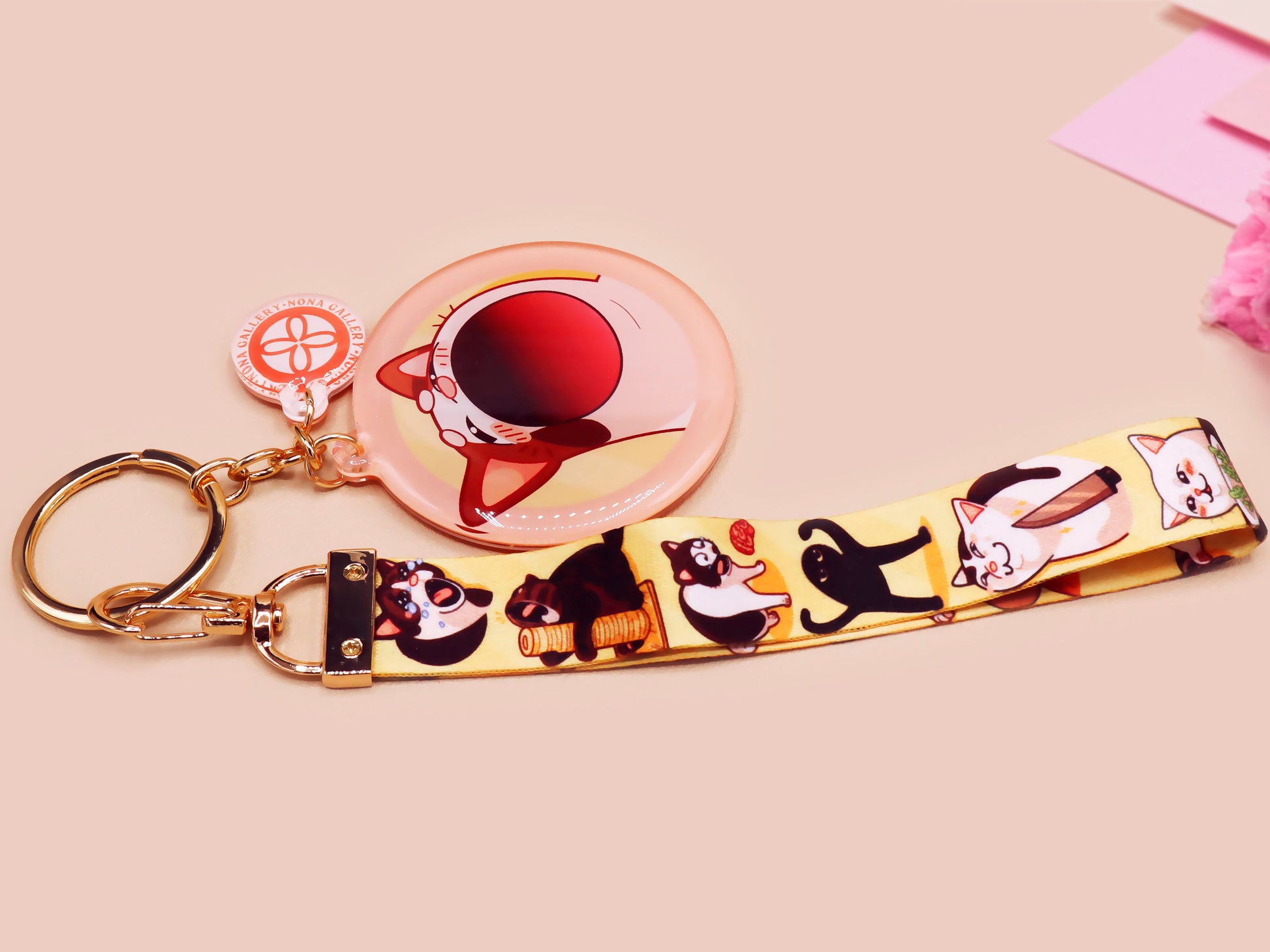Acrylic epoxy meme cat keychain with a large acrylic charm of popcat , a smaller charm of smudge cat and a matching lanyard with multiple different internet famous meme cats.