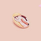 Clear acrylic pin badge with pink heart-shaped rubber pin back clasp. The design of the pin badge is a cute viral internet meme cat with a cheeky relatable reaction.