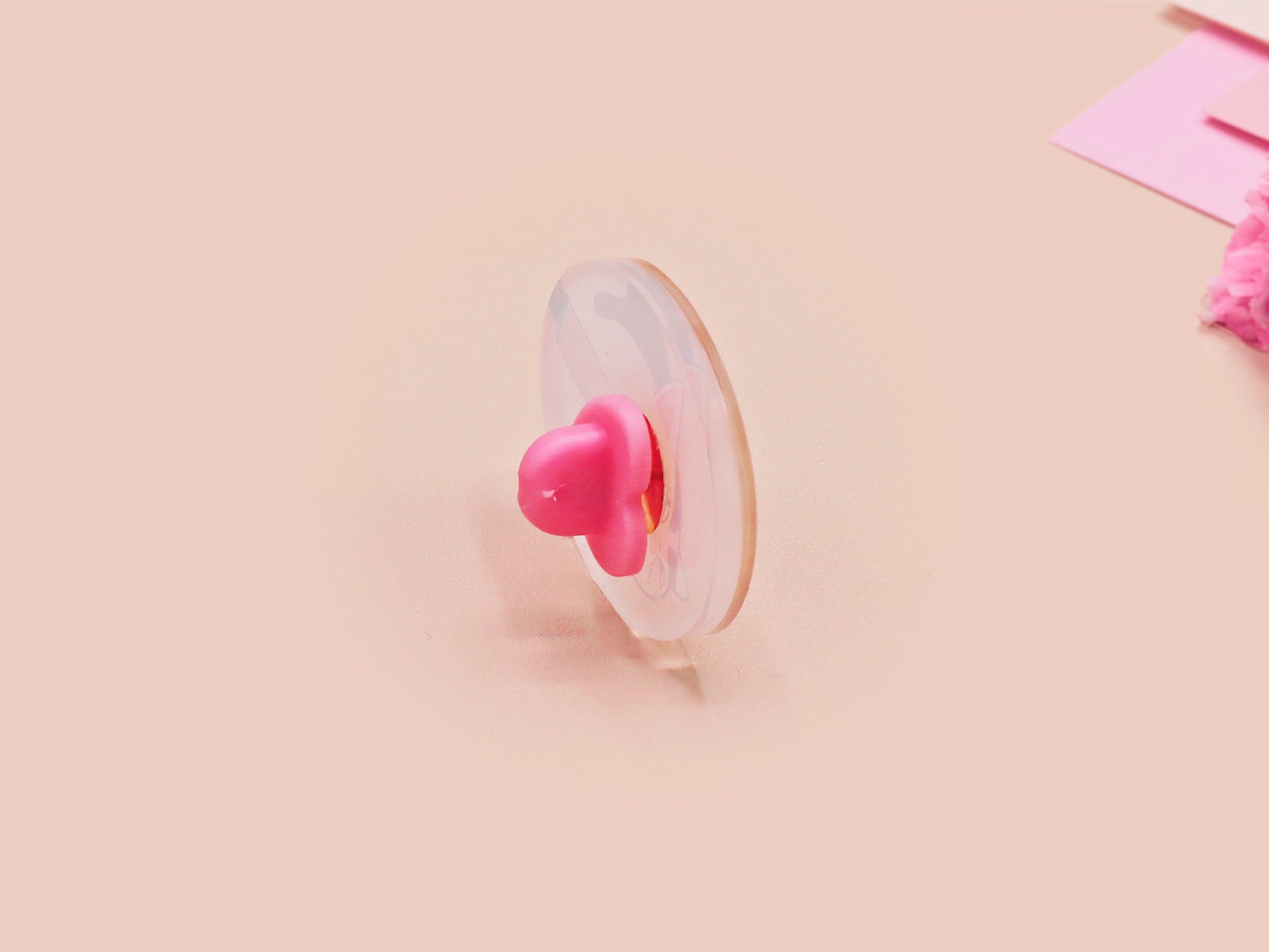 Clear acrylic pin badge with pink heart-shaped rubber pin back clasp. The design of the pin badge is a cute viral internet meme cat with a cheeky relatable reaction.