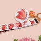 Acrylic keychain with a large charm of the fat angry pygmy hippo being picked up, a smaller charm of a cute baby hippo with the name Moo Deng in Thai and a matching mini lanyard of the pygmy hippo in multiple cute poses and expressions.