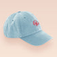 A vintage light blue baseball cap hat with an embroidered cute funny shrimp with the quote not so shrimple is it?