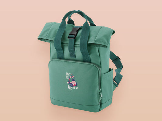 Green roll top twin handle backpack with an embroidered design of a cute frog in a pink car and the quote On My Way To Make Things Worse
