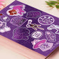 Large purple sticker sheet of digital illustrated cartoons of various space themed items and quotes