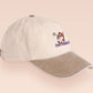 Vintage style truckers baseball cap with a contrast cream and sand peak design with an embroidered cute shiba inu dog overthinking with the quote Overthinker