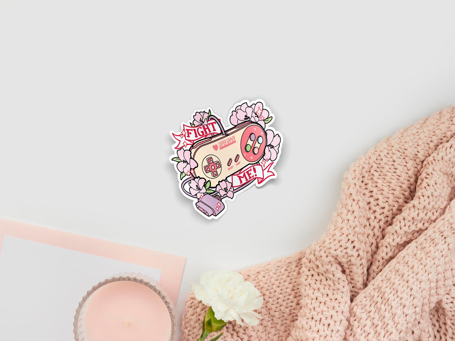 Large sticker of digital illustration cartoons of cute pastel controller with flowers and the quote Fight Me!